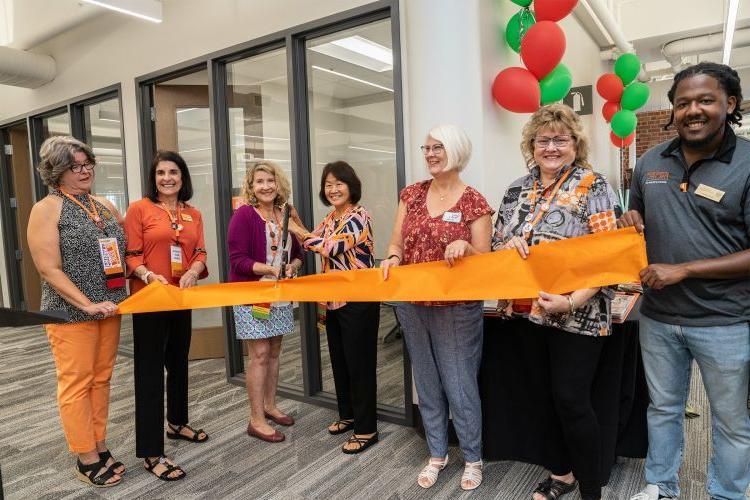 Karen Nakamura (center), Francesca DeMello (second from right) and LaNor Smith (far right) at the naming of the Alpha Chi Omega Study Room during Homecoming and Family Weekend in 2022. 